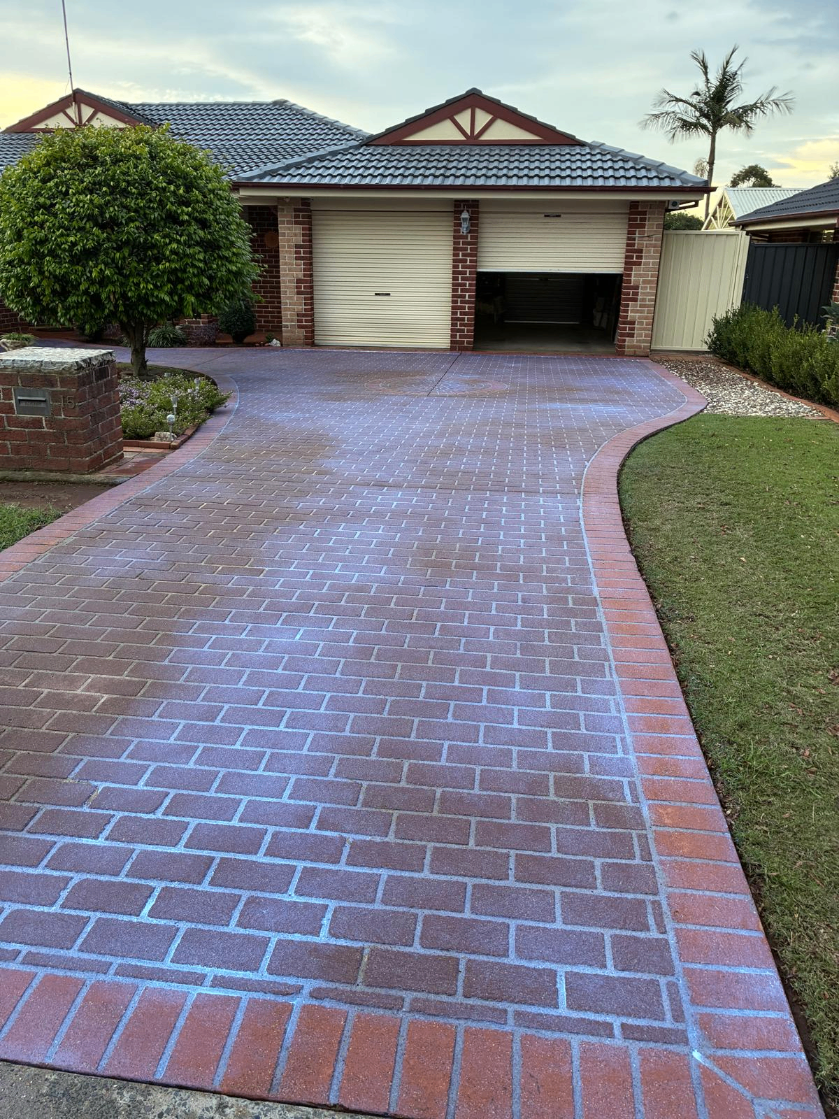 After — Paver driveway before and after high-pressure cleaning