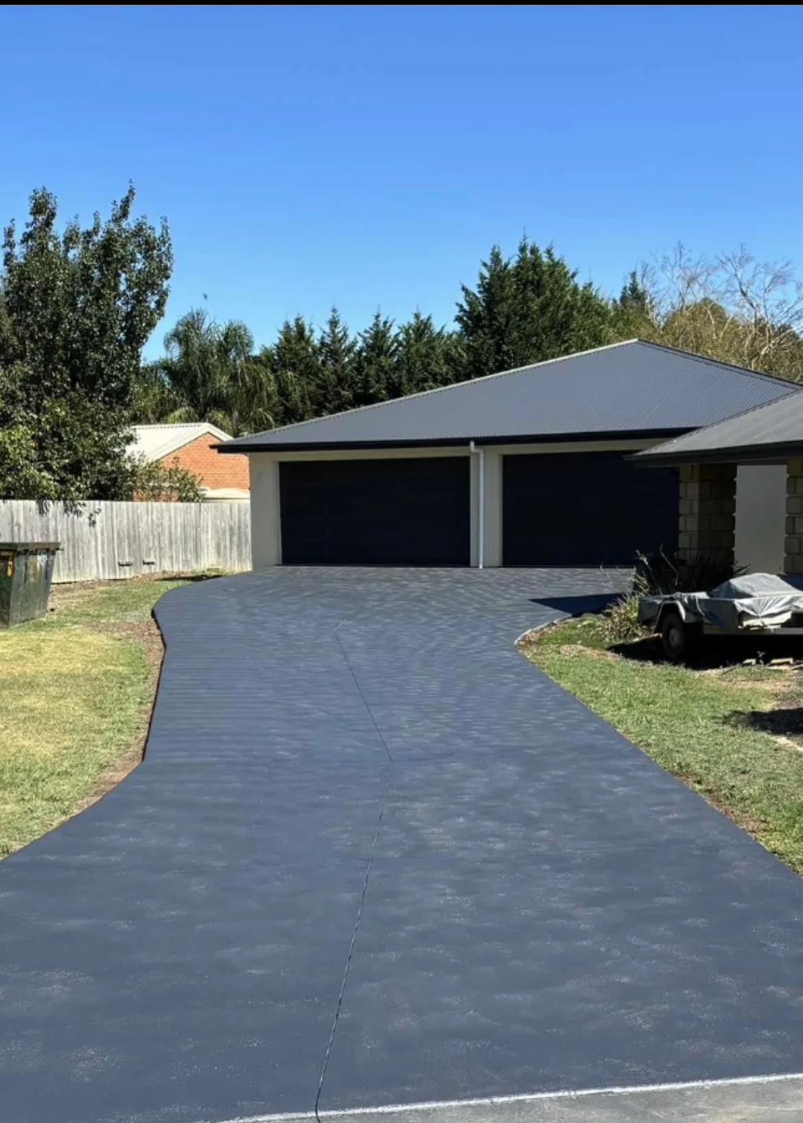 After — Concrete driveway before and after painting